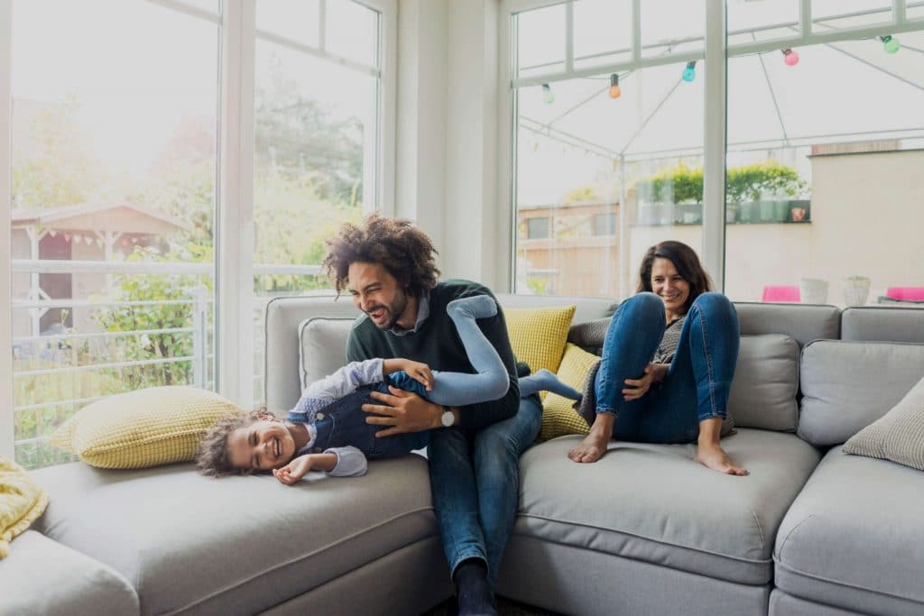 happy family sitting on couch